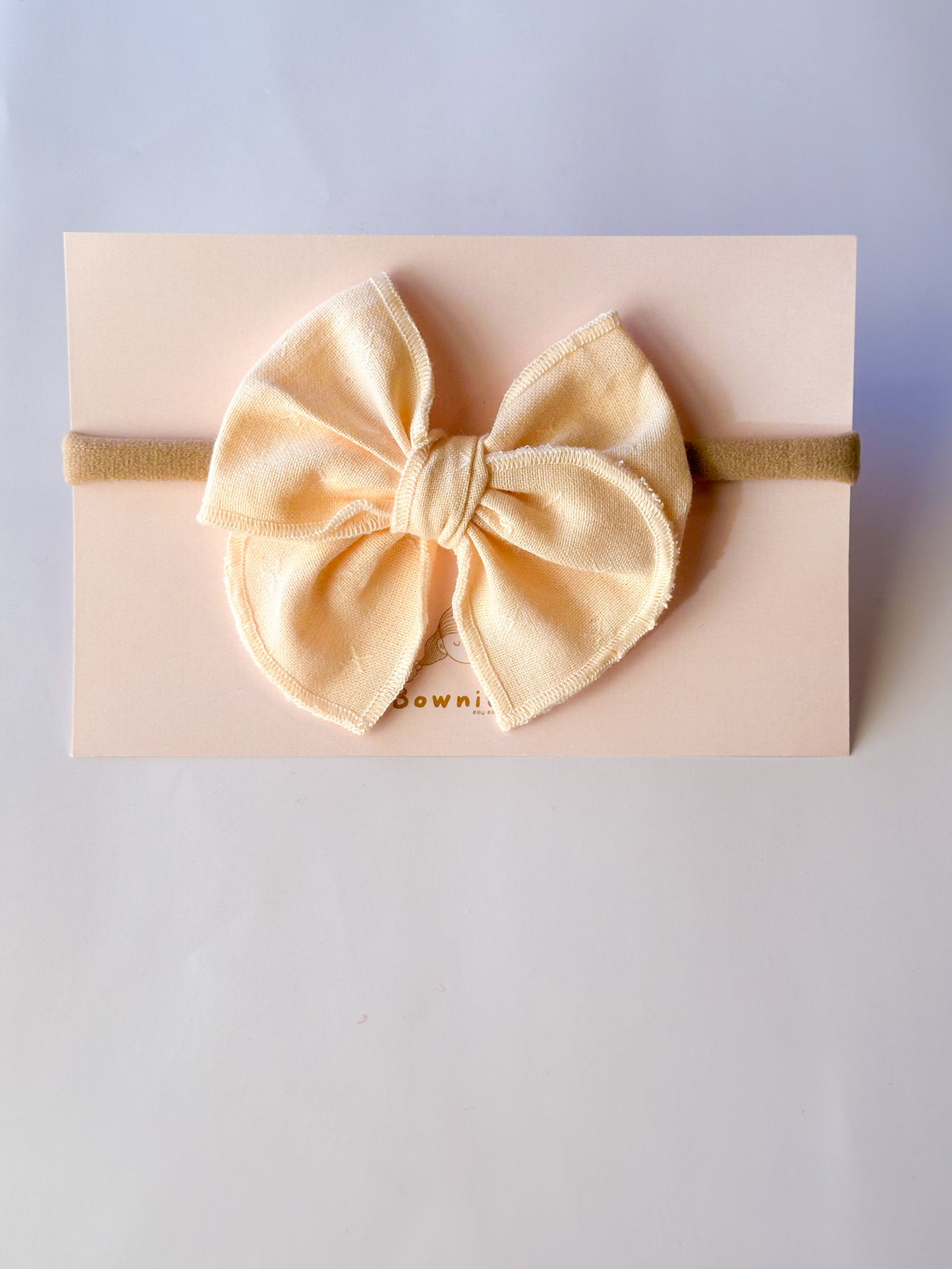 Butter cream linen bow