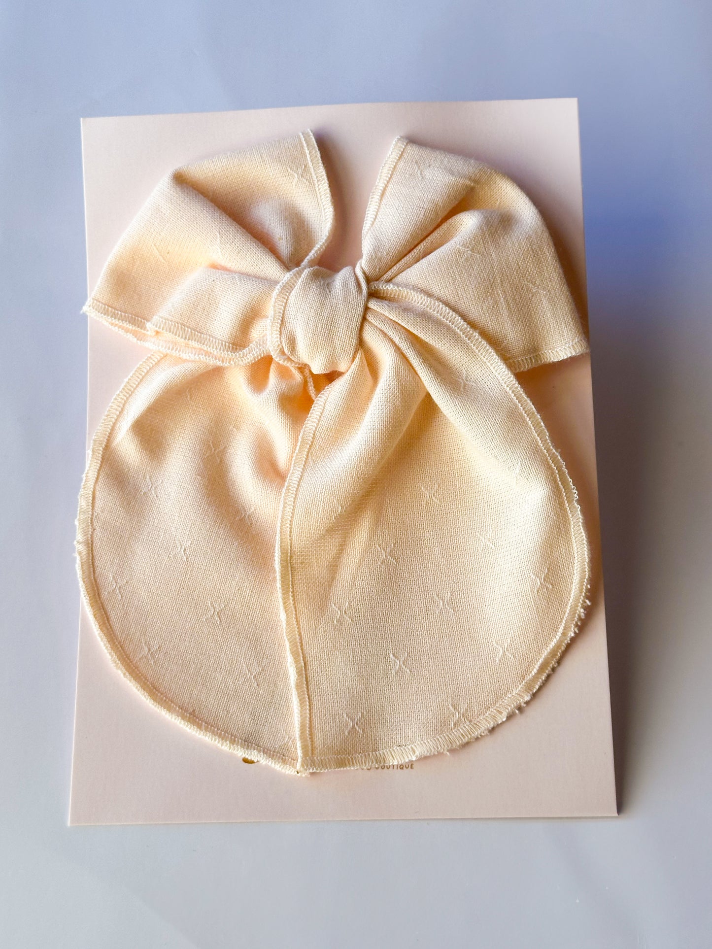 Butter cream linen bow